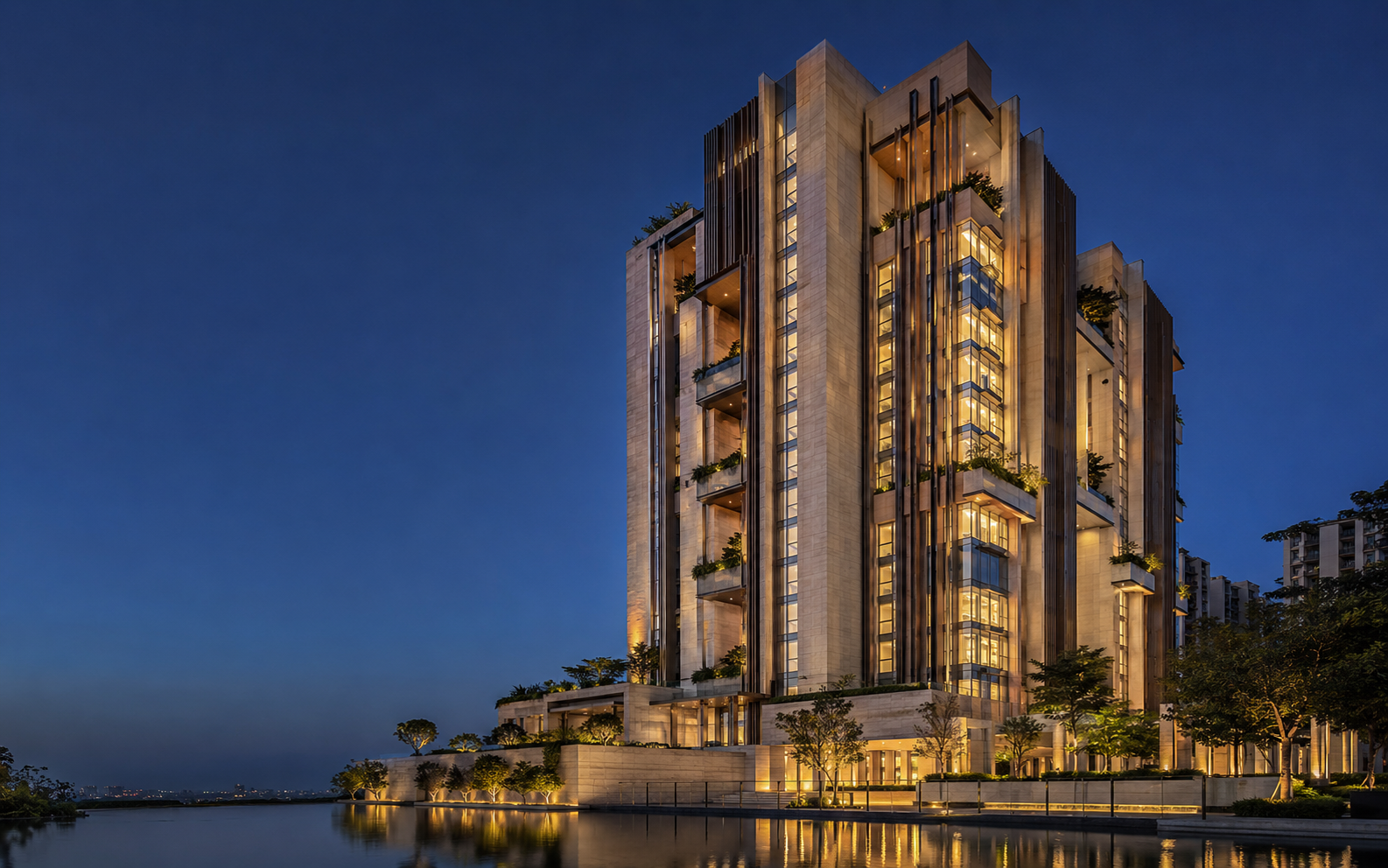 A Brykston luxury tower at blue hour reflected in still water